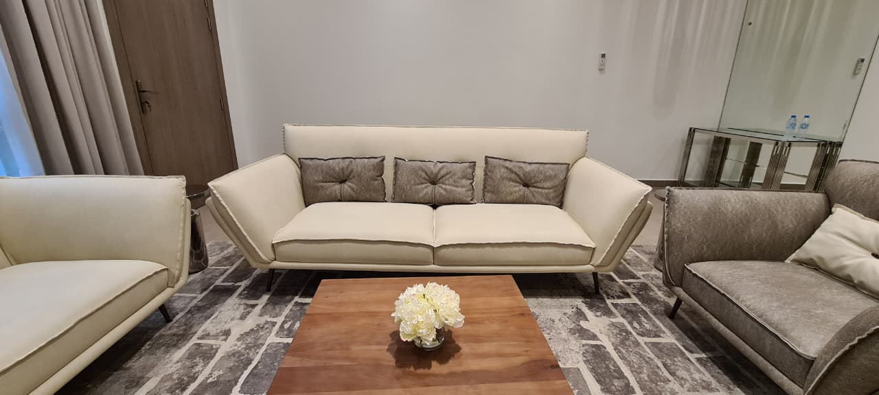 modern lounge with custom sofa set and sculptural coffee table